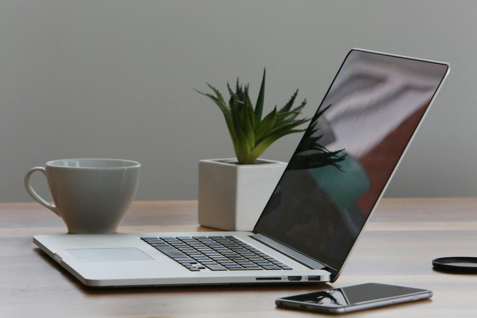 Laptop on the table with coffee mug
