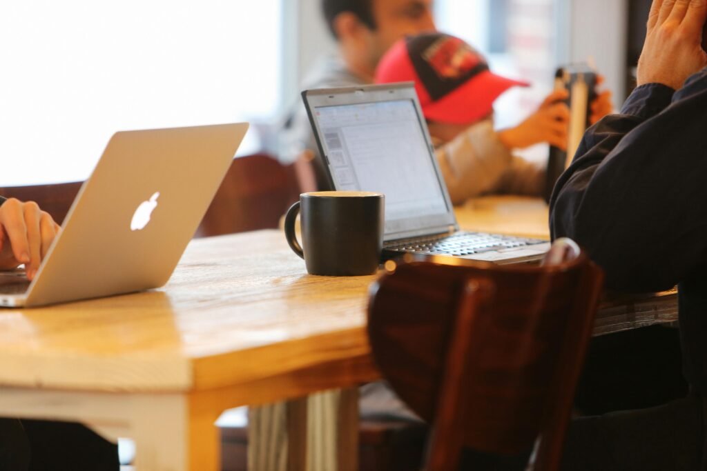 Students using laptop on a table