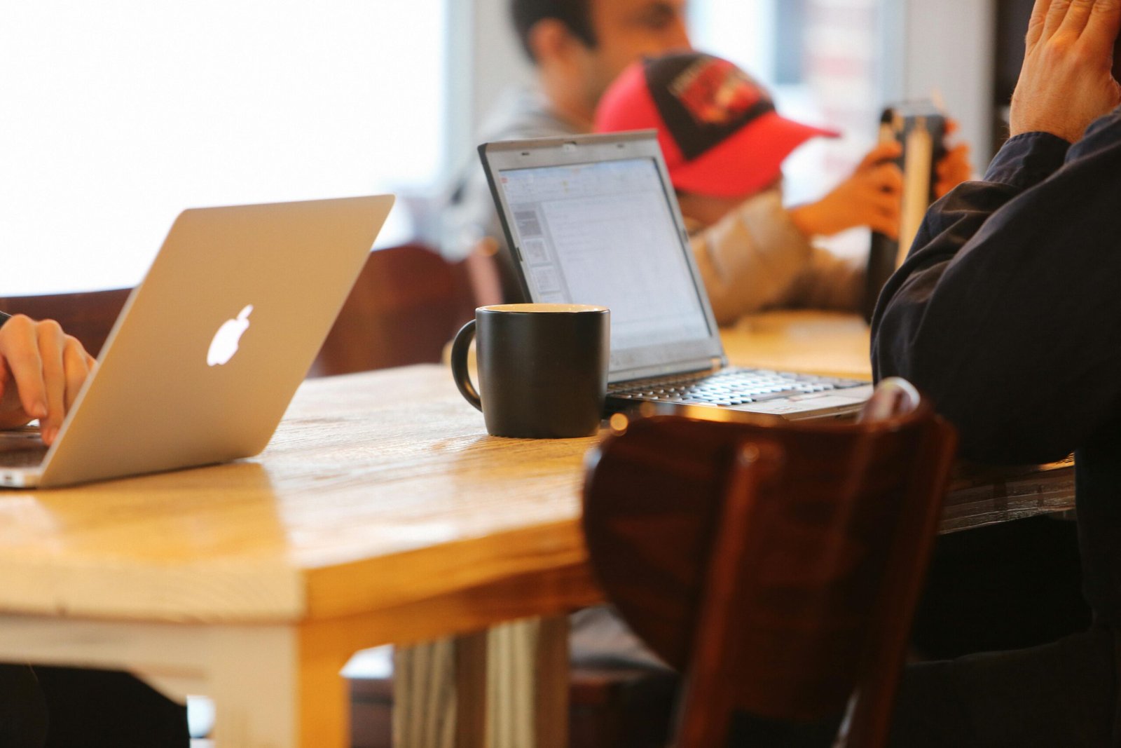 Students using laptop on a table